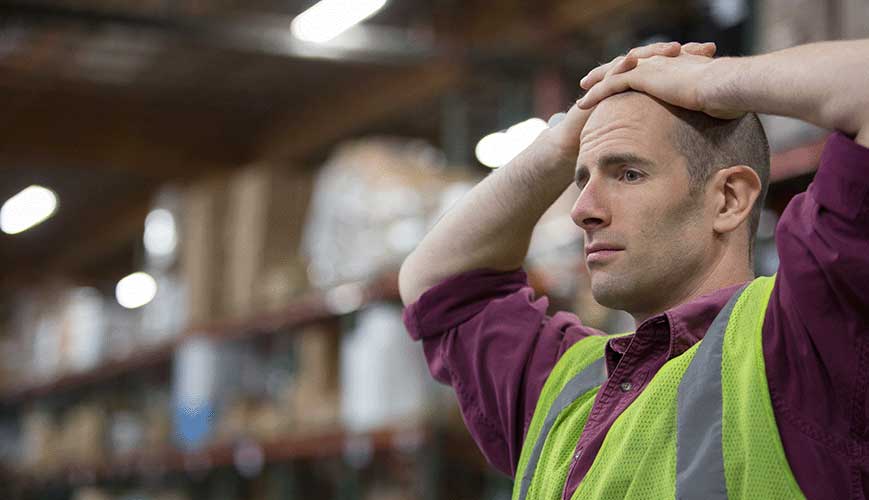 Fatigued Warehouse Worker